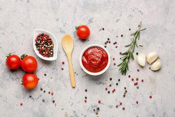 Composition with bowl of tasty tomato paste and spices on white grunge background