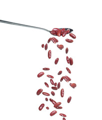 Red Bean fall, red grain beans explode abstract cloud fly from silver spoon. Beautiful complete...