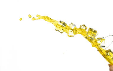 Pouring lime juice down to glass, lime juice fall down in yellow liquid water. Cold Ice Cube mix green lime juice throw splash in air. White background Isolated high speed shutter, freeze action
