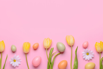Composition with painted Easter eggs and spring flowers on pink background