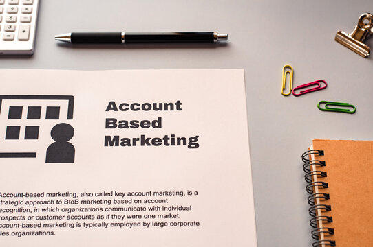 There is dummy documents that created for the photo shoot on the desk about Account Based Marketing.