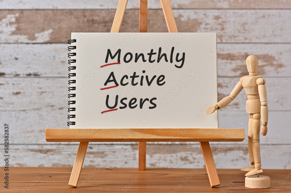 Poster there is a notebook with the word monthly active users. it is eye-catching image.