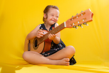 Talented red-haired girl playing guitar and singing.