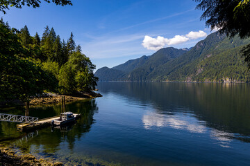 Obraz premium boat on a lake or inlet on Indian Arm, North Vnacouver, BC Canada