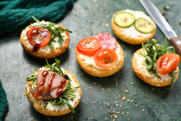 Board with delicious sandwiches, closeup