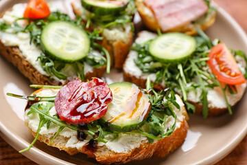 Plate with delicious sandwiches, closeup
