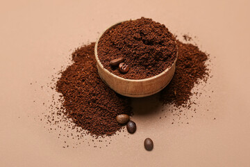 Bowl of coffee powder and beans on brown background - obrazy, fototapety, plakaty