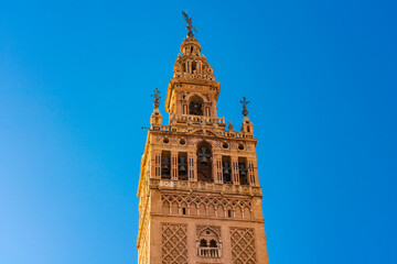 View of la Giralda, the bell tower of the cathedral of Seville from the rooftop of the cathedral, It was originally built as the minaret for the Great Mosque of Seville in al-Andalus, Moorish Spain