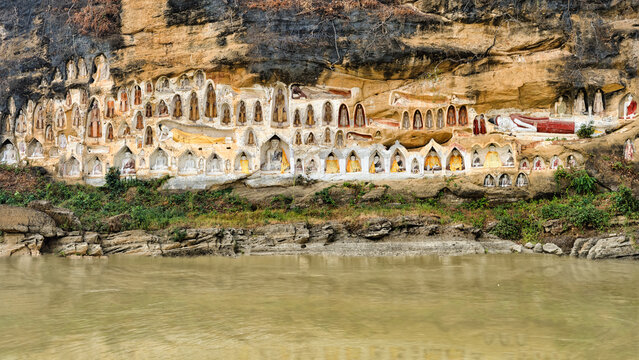 Akauk Taung Buddha Sculptures on Cliff Face along Irrawaddy River in Pyay Myanmar