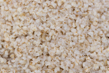 boiled barley groats closeup selective focus