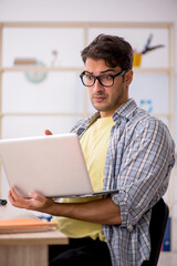 Young male freelancer working from home