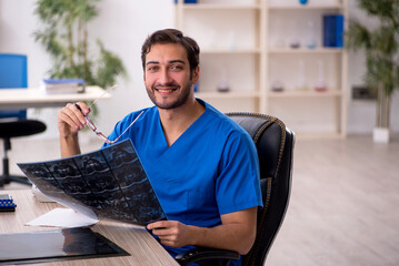 Young male doctor radiologist working in the clinic