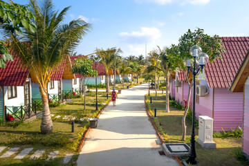 Overview of 4-star TTC resort with rows of bungalows at Ninh Chu beach Van Hai ward , Son Hai, Phan Rang city, Vietnam - obrazy, fototapety, plakaty