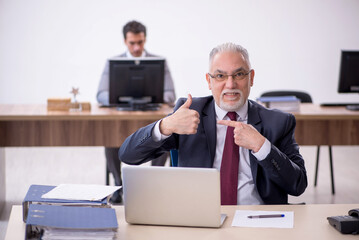 Two male colleagues working in the office