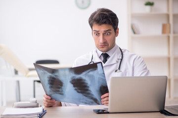 Young male doctor radiologist working in the clinic
