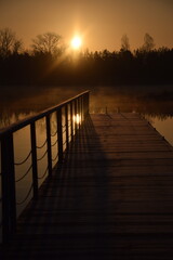 wooden bridge over lake