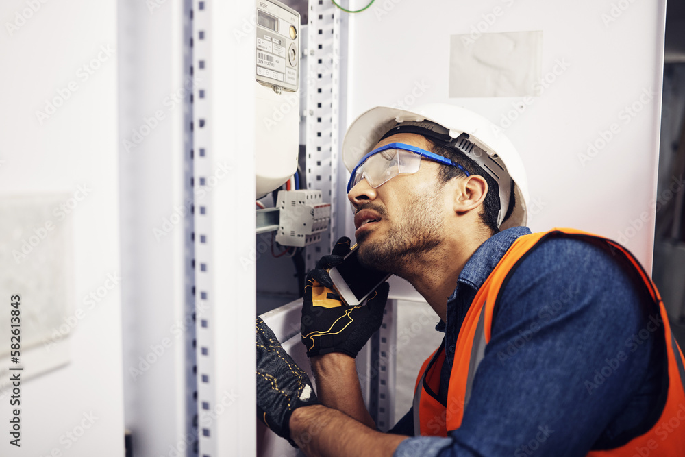 Wall mural Man, phone call and engineering in control room, switchboard or industrial system inspection. Male electrician talking on smartphone at power box, server mechanic or electrical substation maintenance