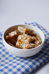 peanuts sweet candy in a bowl on table 