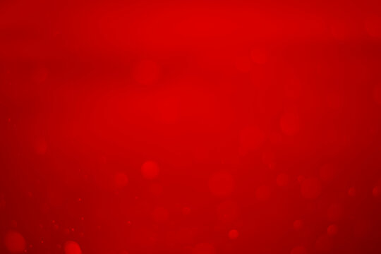 red glitter vintage lights background. red bokeh shiny on dark background.