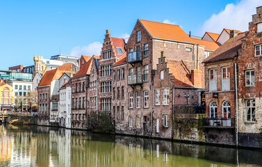 Fototapeta na wymiar The river and medieval houses of Ghent, a city in the Flemish region of Belgium. Travel concept