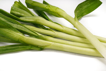 Green onions close-up on white background