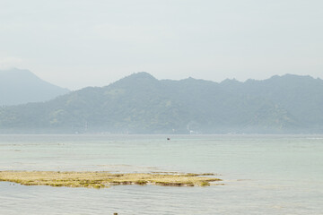 Lombok and Gili Air islands, overcast, cloudy day, sky and sea. Sunny day, sand beach.