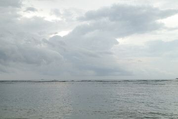 Lombok and Gili Air islands, overcast, cloudy day, sky and sea. Sunset, sand beach.