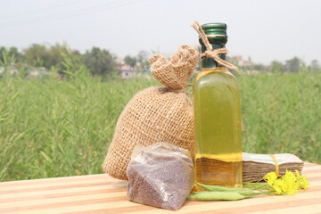 mustard oil with seed flower and money bag