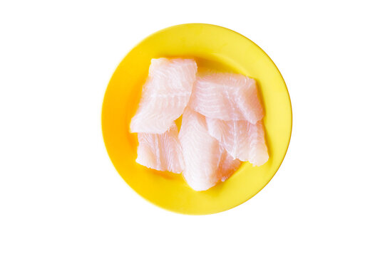 Fresh White Don Lee Fillets Cut Into Bite-sized Pieces On A Plate, Top View Shot