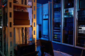 Server room of modern data center with racks and wires