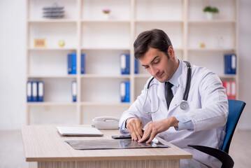 Young male doctor radiologist working in the clinic