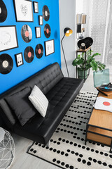 Living room decorated with vinyl records. Interior design