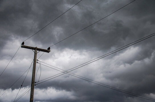 electricity pole with cloudy and storm background
