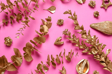 Obraz na płótnie Canvas Flat lay composition with golden dried flowers and eucalyptus branches on pink background