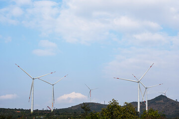 Wind generator turbines at wind farm. Alternative energy concept.