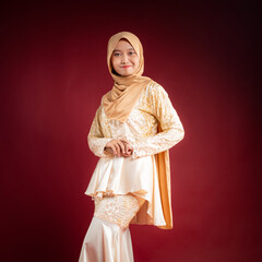 Portrait of a beautiful Asian Muslim female model wearing hijabwear with at a studio photoshoot. Modern hijab fashion and beauty concept