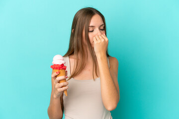 Young Lithuanian woman with cornet ice cream isolated on blue background having doubts