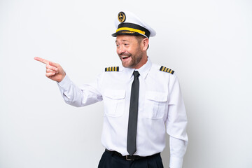 Airplane middle age pilot isolated on white background pointing finger to the side and presenting a product
