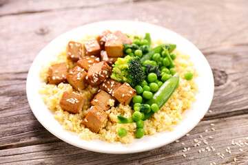 plate with fried tofu and vegetables