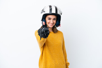 Young caucasian woman with a motorcycle helmet isolated on white background with thumbs up because something good has happened