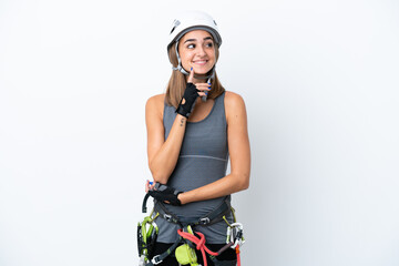Young rock-climber woman isolated on white background thinking an idea while looking up