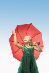 Happiness, delight, emotional kid, little girl on blue sky background.