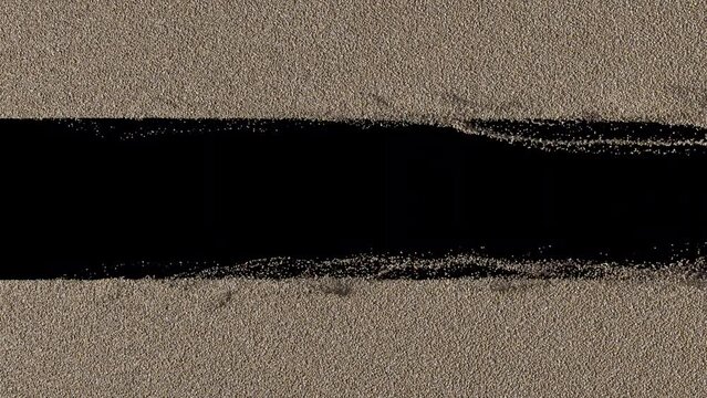 Sand blowing transition reveal on alpha background