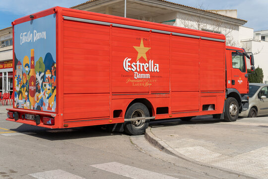 Red delivery truck of the company Estrella Damm