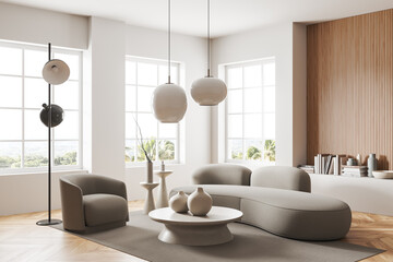 Light living room interior with armchair and couch with decoration and window