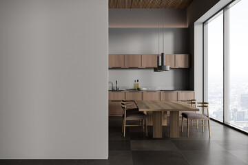 Panoramic gray kitchen interior with cabinets and table