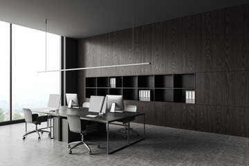 Grey business interior with pc computer and shelf near panoramic window