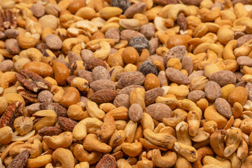 A group of almonds, pistachios, walnuts, macadamia, cashews.