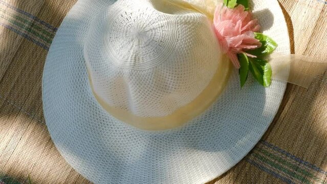 Summer scene, straw hat on bamboo mat ,rug. Relaxing in the shade, enjoying nature