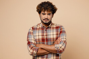 Sad student Indian man wear brown shirt casual clothes look camera hold hands crossed folded...